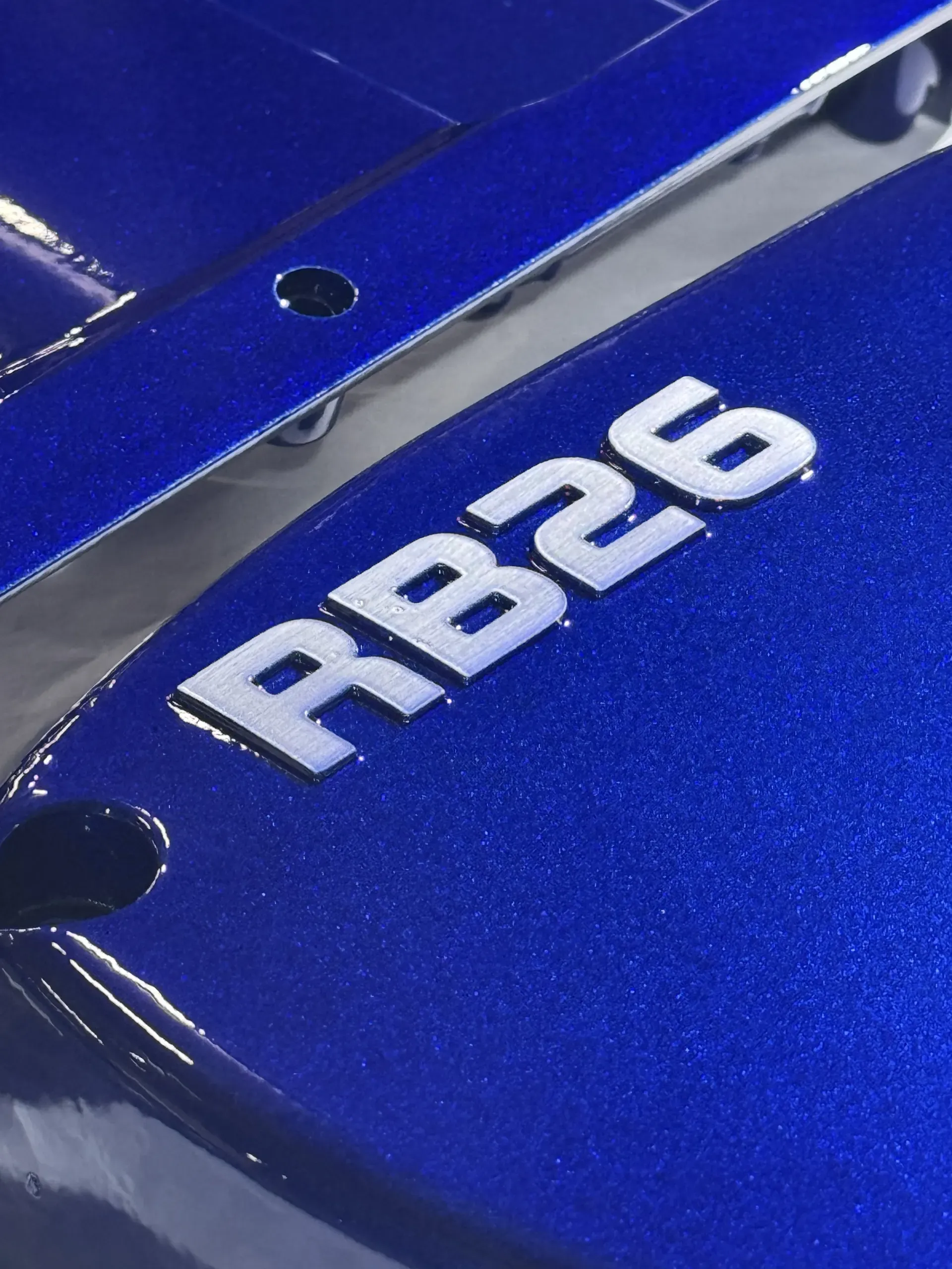 RB26 cam cover in candy blue with raised lettering